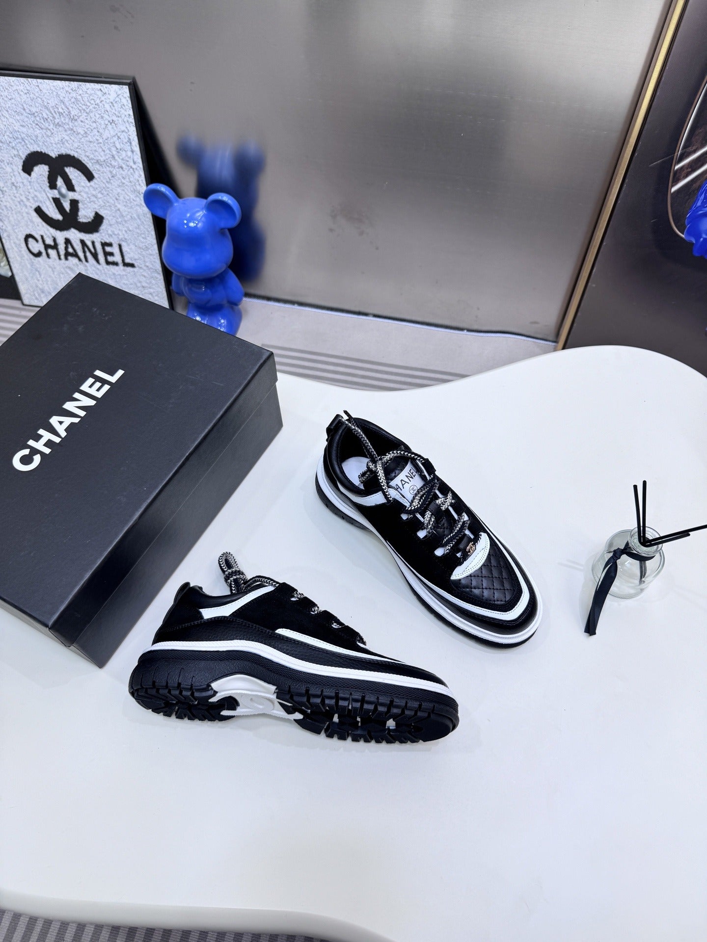 Chanel Leather Logo Sneakers