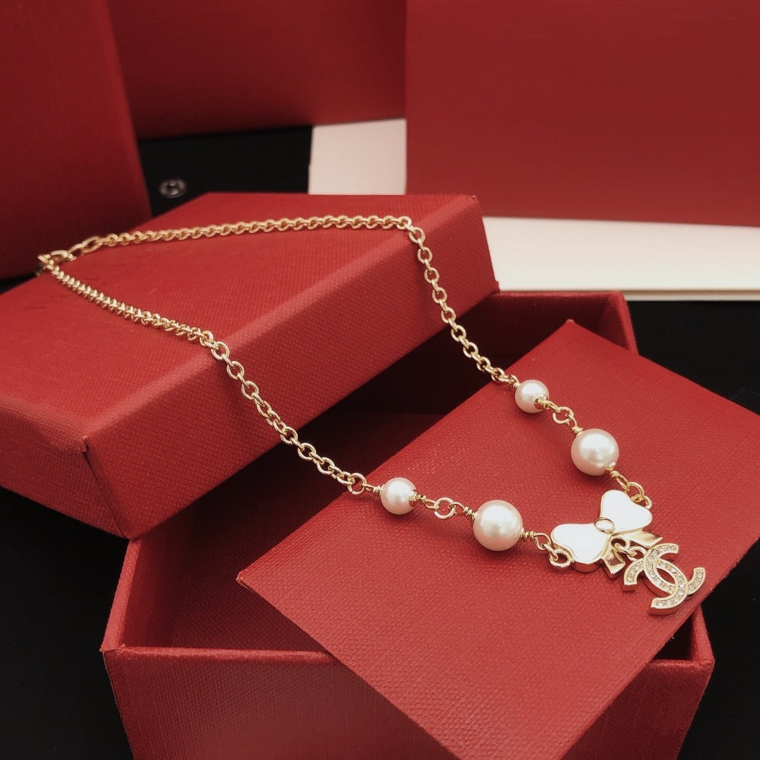 Chanel Brass Bow Necklace