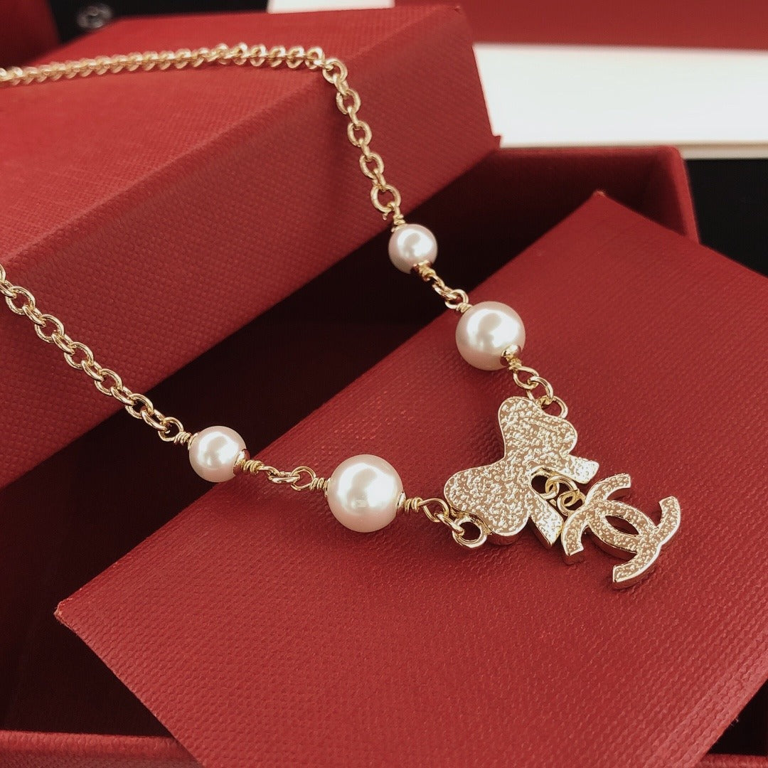 Chanel Brass Bow Necklace