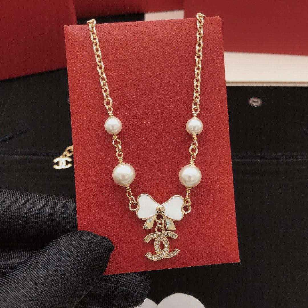 Chanel Brass Bow Necklace